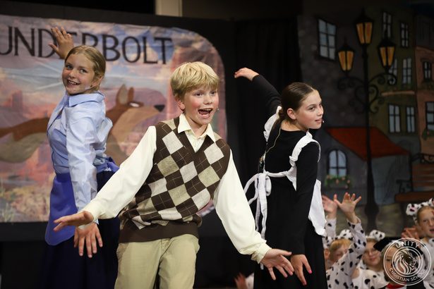 Three students performing an ensemble scene