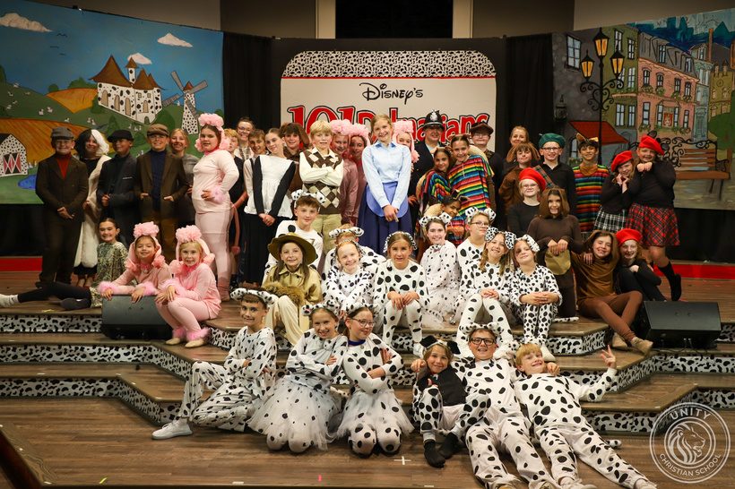The full cast of 101 Dalmatians Kids on stage