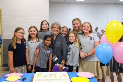 Ms. Sis with a group of Unity students at a celebration