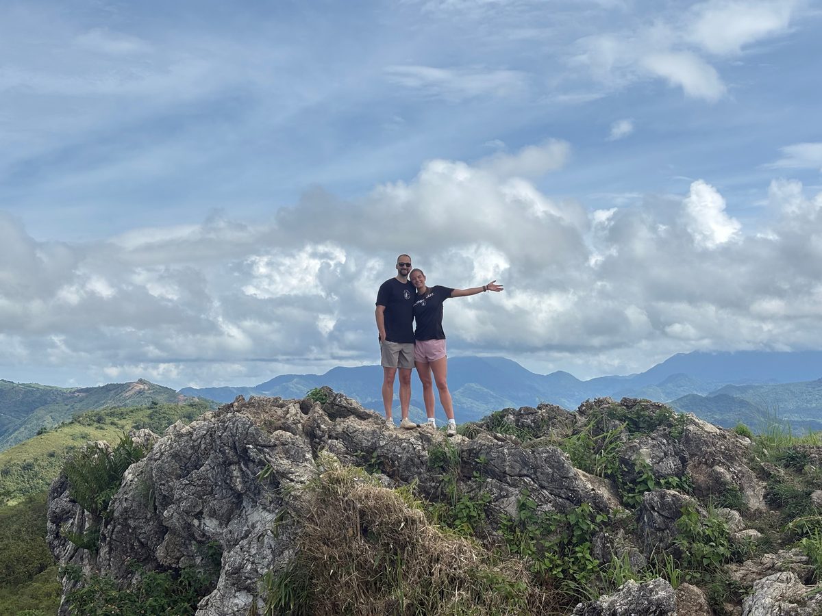 Davy Fisher standing on a mountaintop in the Philippines