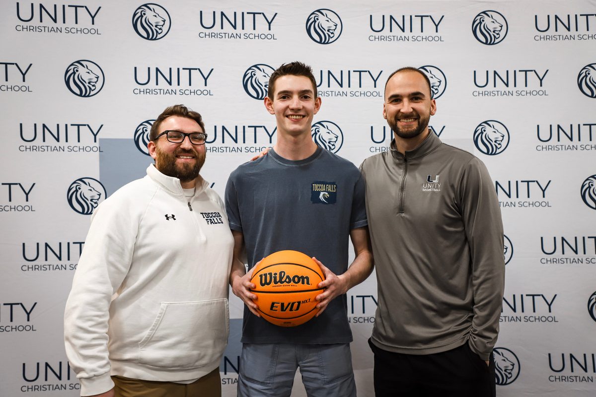 Sam James with Coach Fisher on signing day