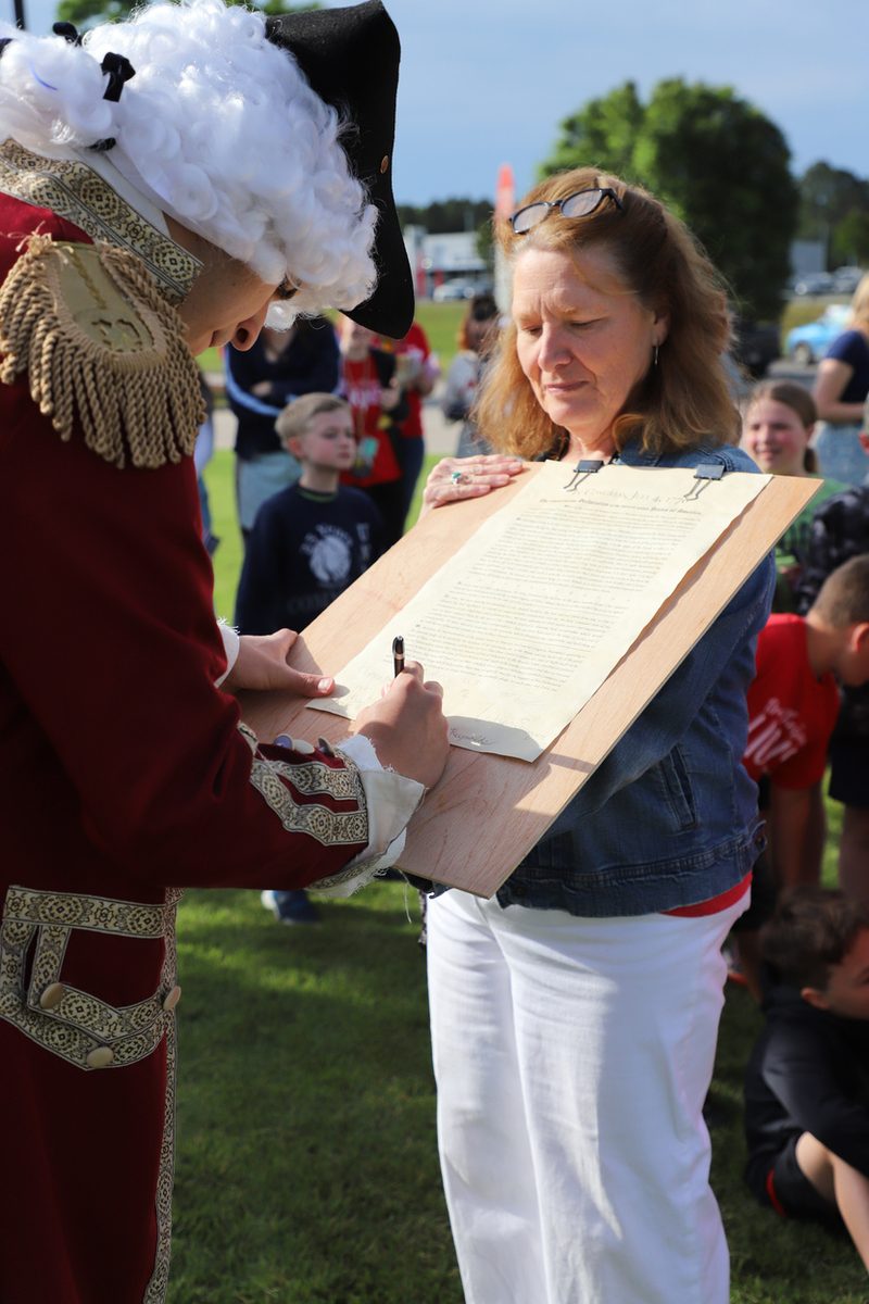 A senior reading from the Declaration of Independence