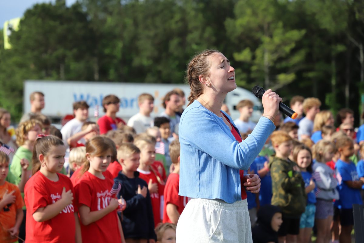 Rose Hill singing the National Anthem