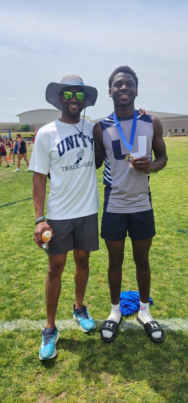 Mikey Ferguson with his coach and his state championship medal