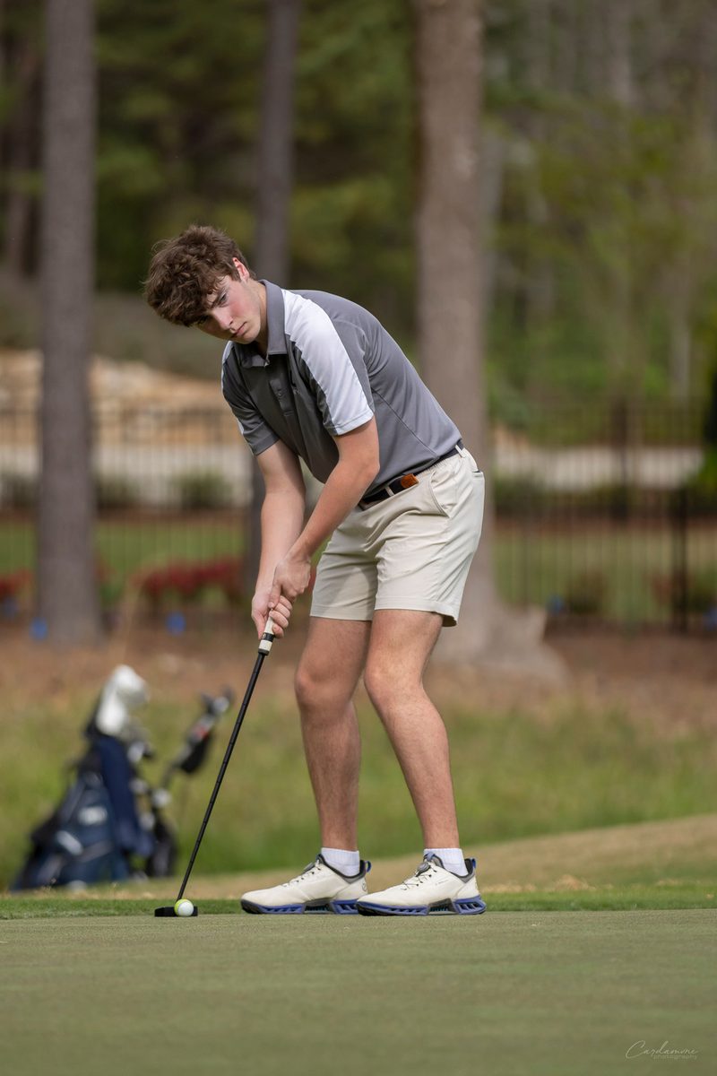 A Unity golfer putting on the green