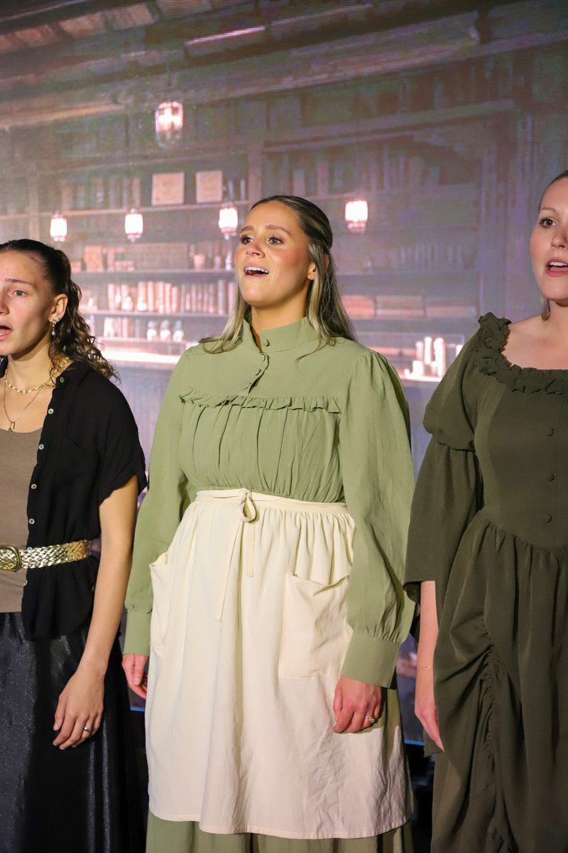 Mary Elizabeth Orr on stage with two other performers