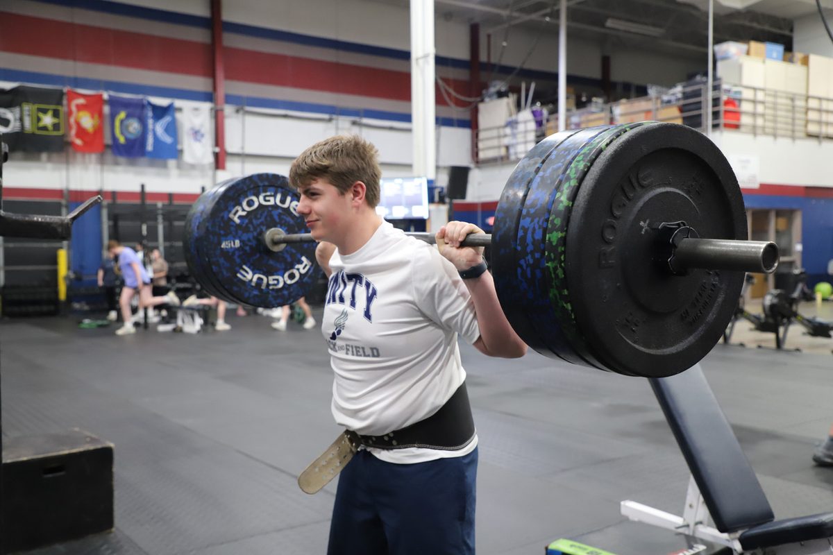 A Unity student lifting in the weight room