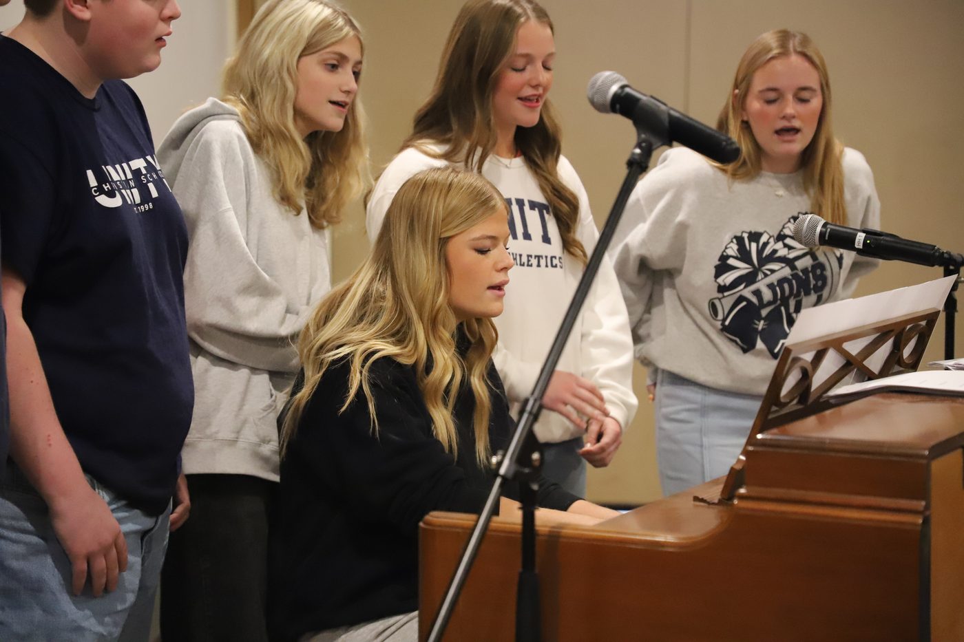 Unity students leading worship at the piano